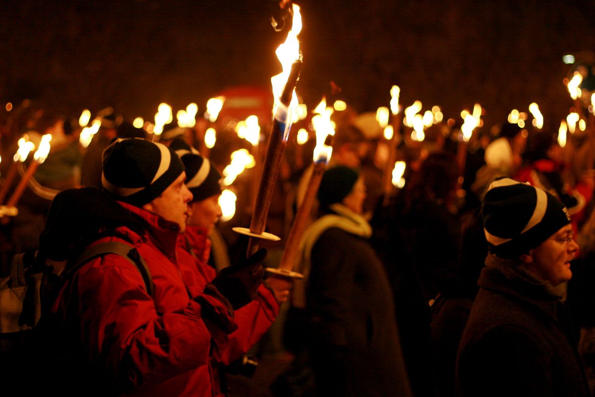 Hogmanay torchlight procession and fireworks on Calton Hill, Edinburgh, Scotland
