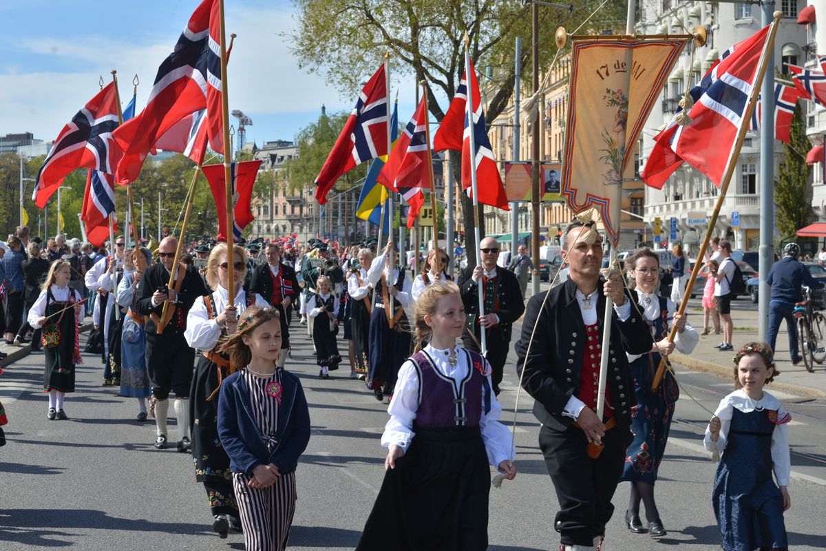 Norwegian Constitution Day parade celebration in Stockholm with traditional bunads and flags