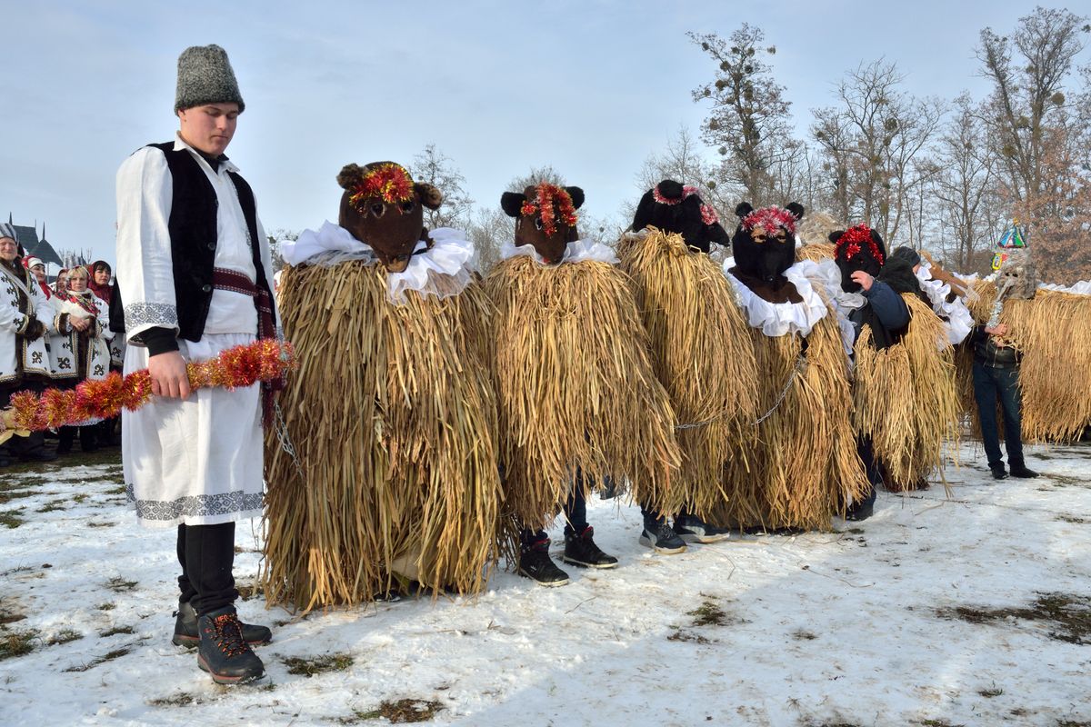 Malanka winter carnival with performers in bear costumes at ethnic festival in Chernivtsi, Ukraine